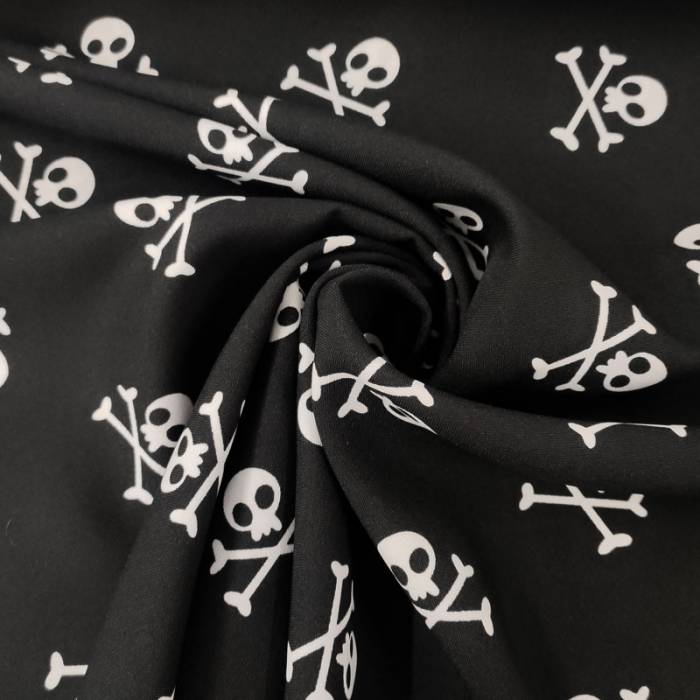Tessuto Teschi Pirati Sfondo Nero