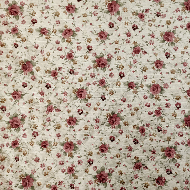Tessuto trapuntato con fiori rosa