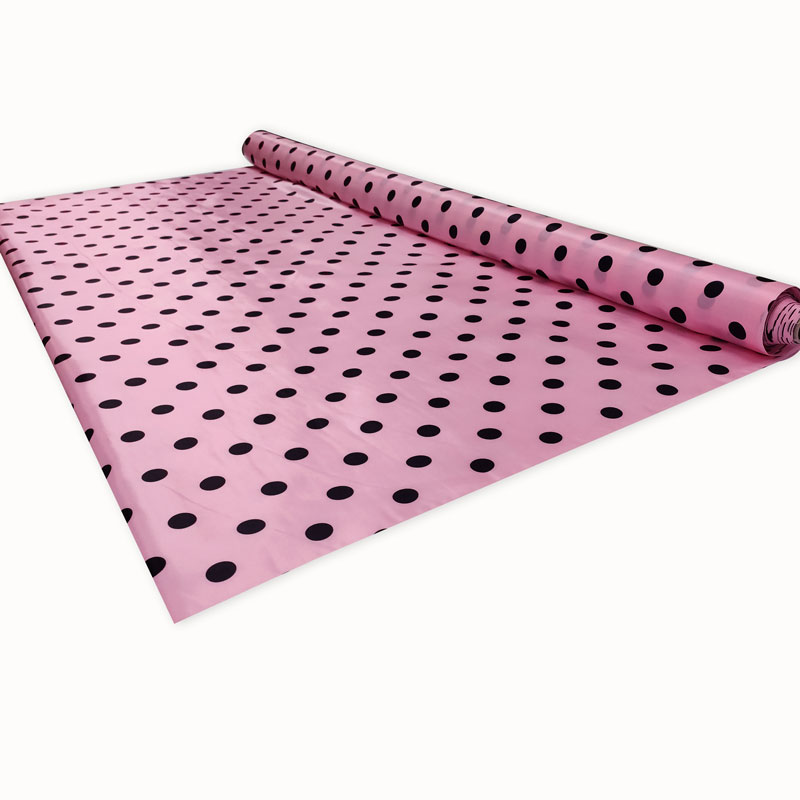 Tessuto costumi carnevale pois neri sfondo rosa