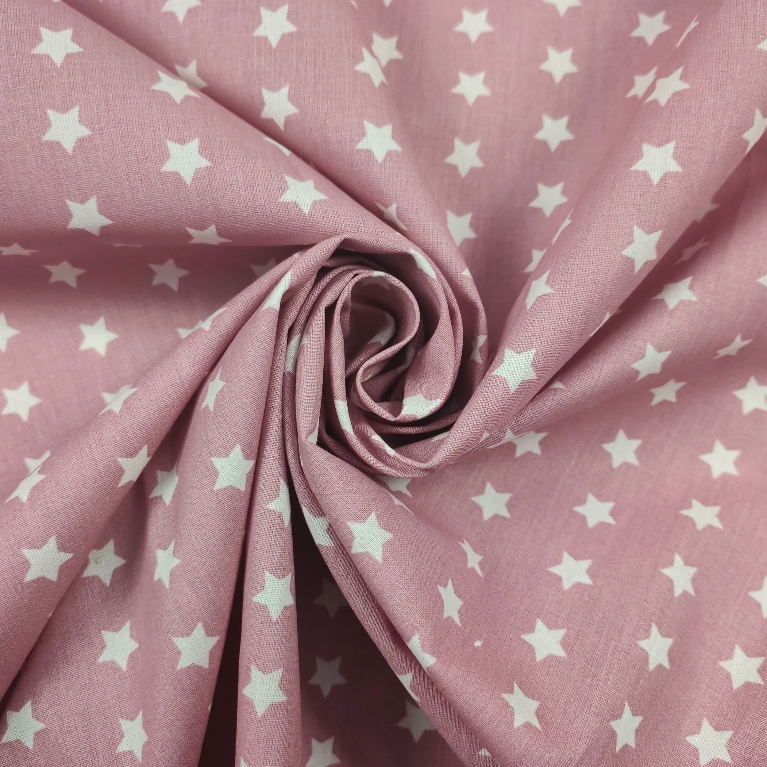 cotone con fantasia di rosa antico stelle bianche