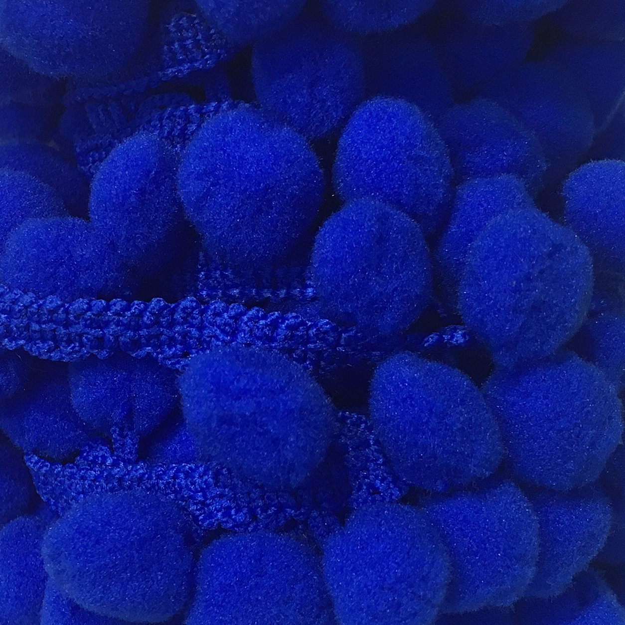Pon pon pendente colore bluette