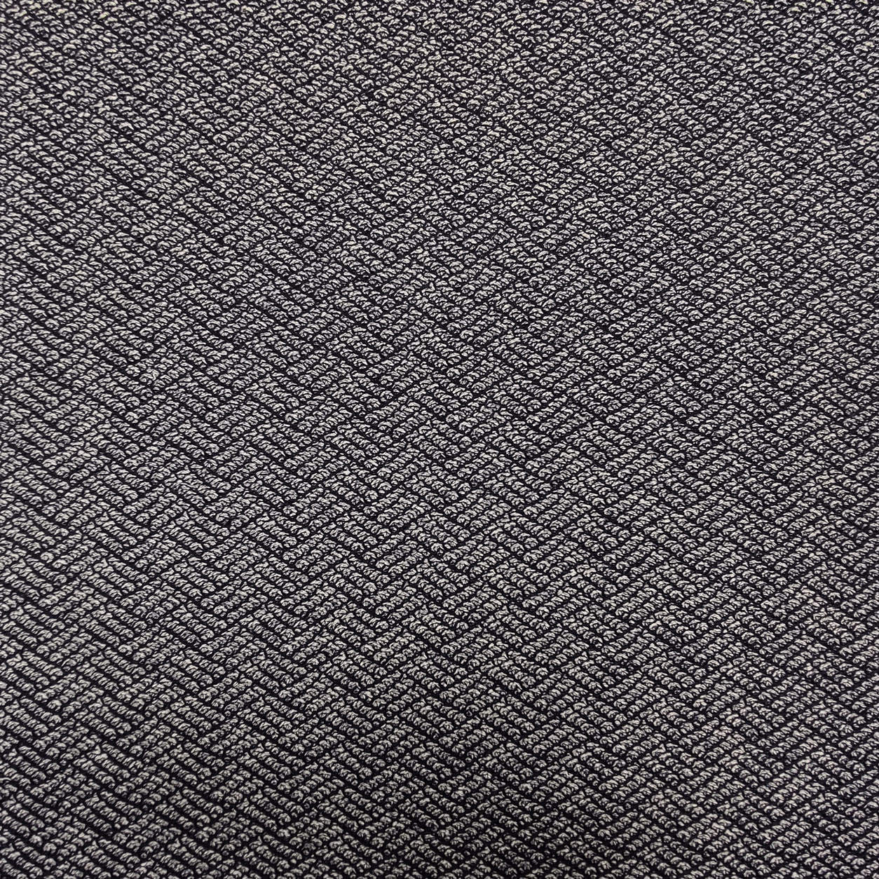 tessuto-maglia-motivi-geometrici-sfondo-blu