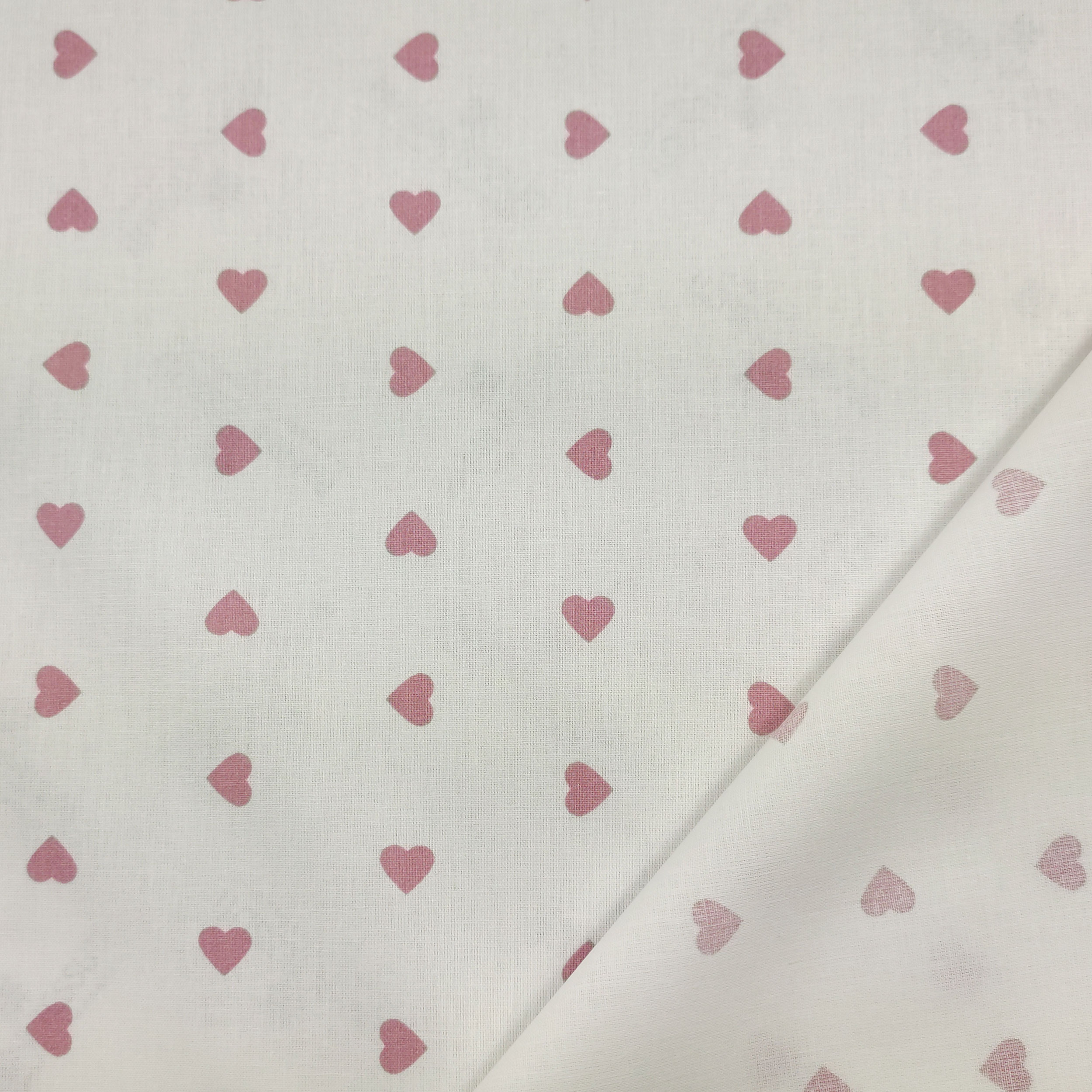tessuto cotone leggero cuore rosa antico sfondo bianco