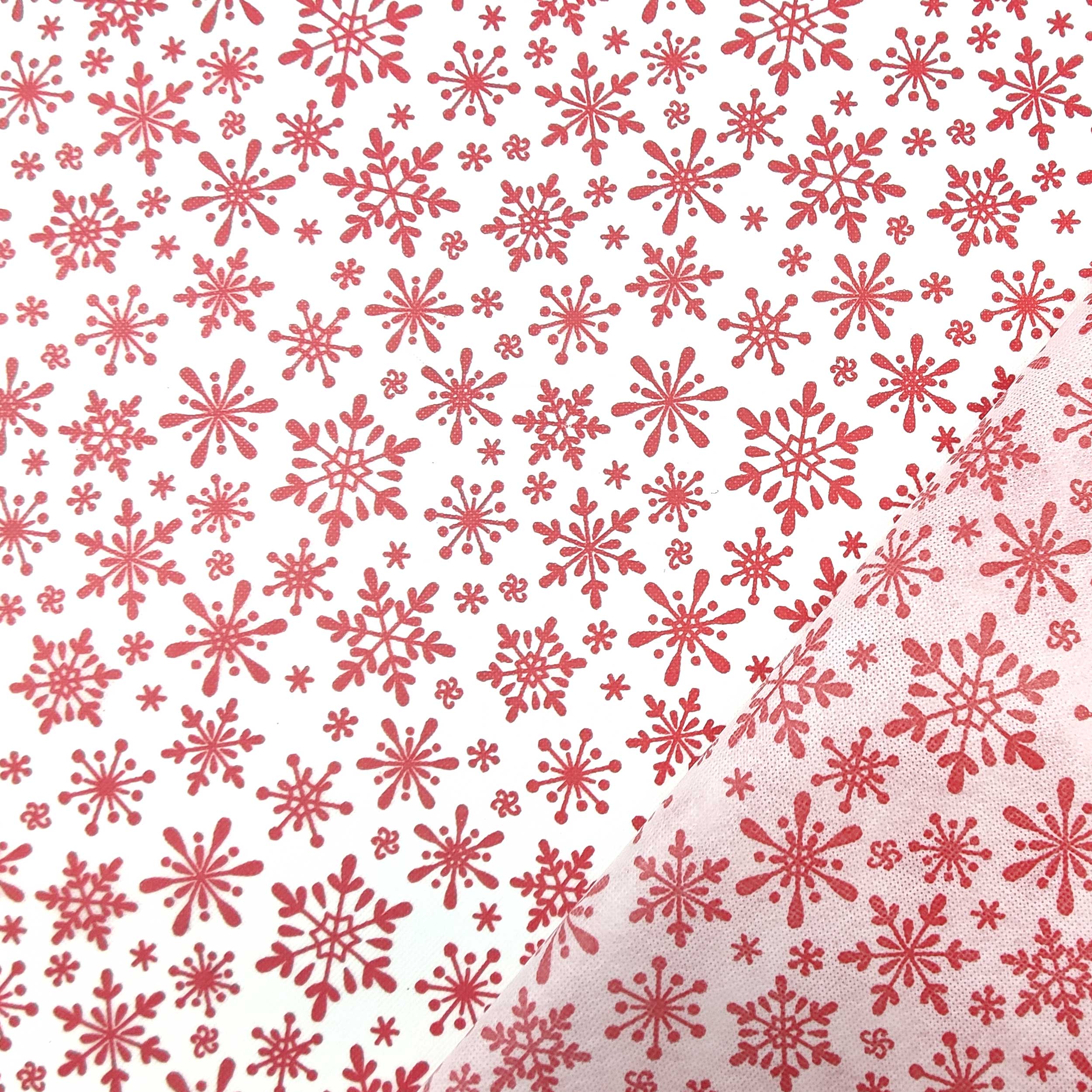 tessuto online in tnt bianco con fiocchi rosso