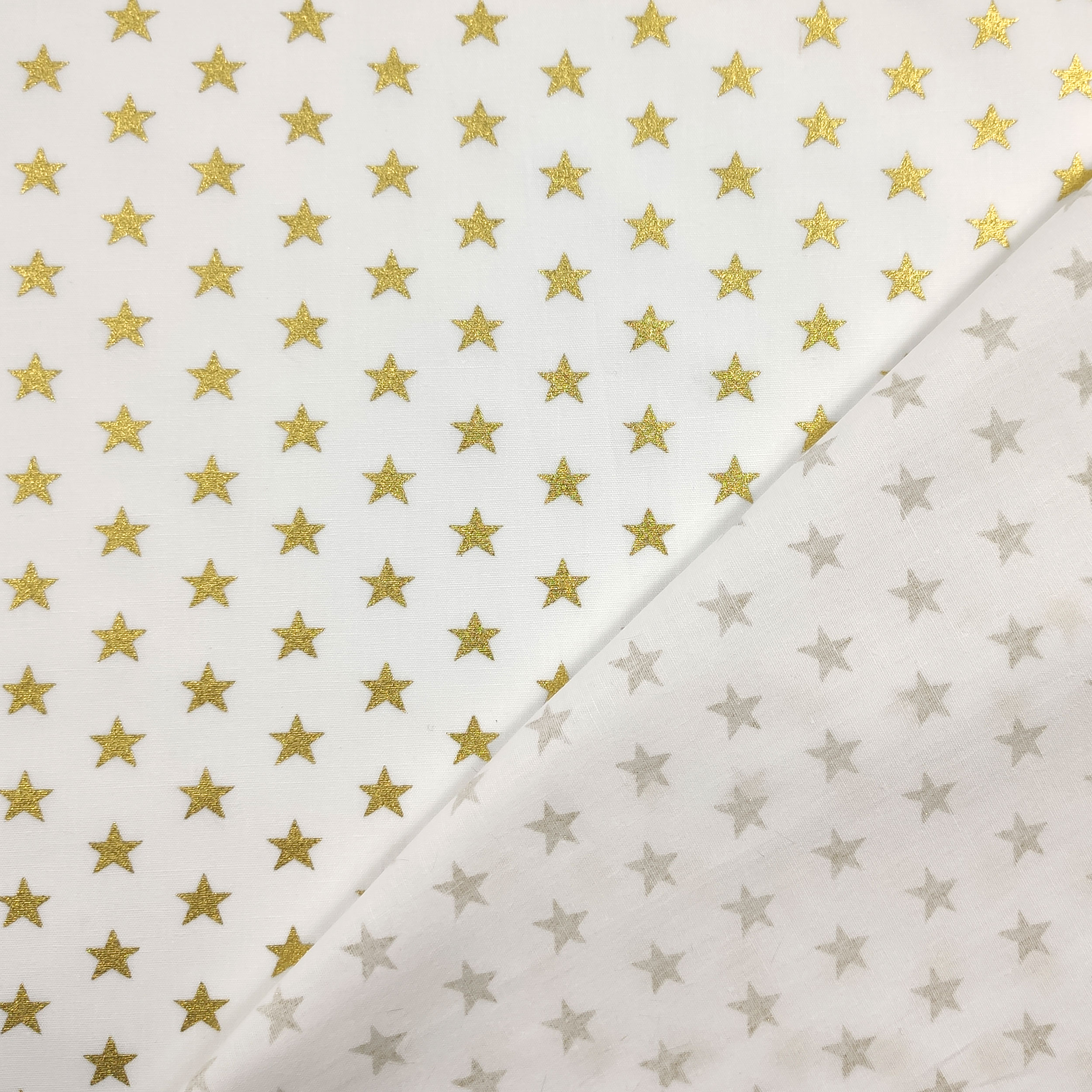 Tessuto Cotone Stelle Lurex Oro Sfondo Bianco