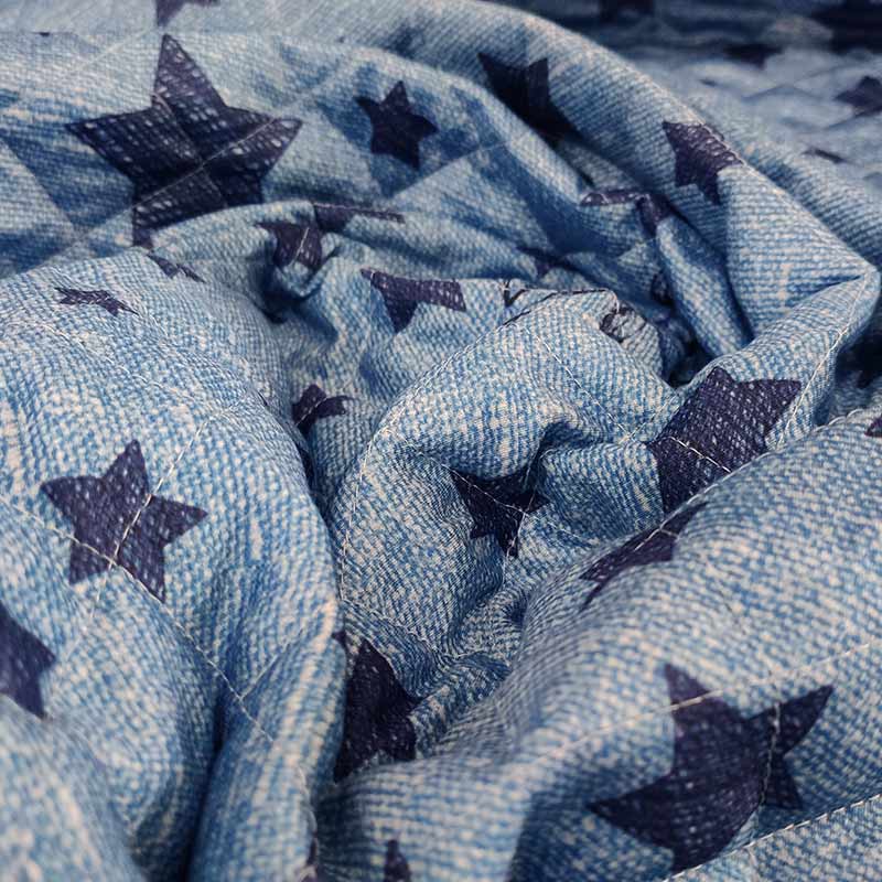 Tessuto trapuntato con orsetti effetto jeans