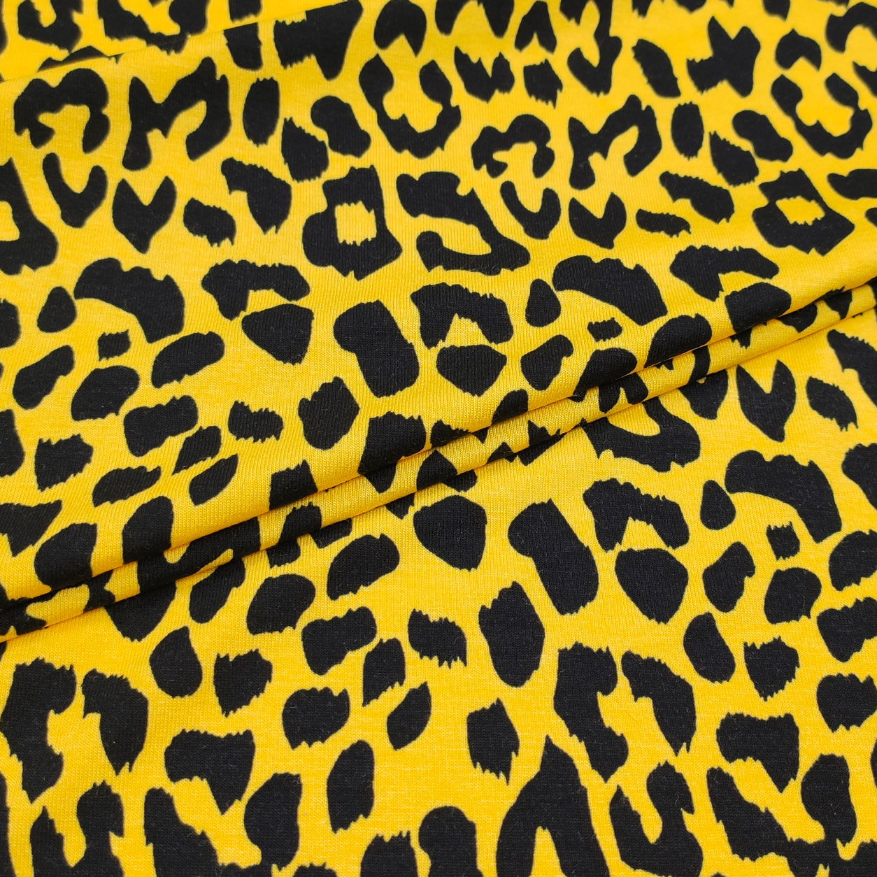 tessuto jersey leopardato nero sfondo giallo