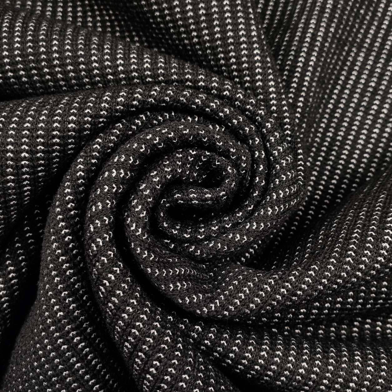 Tessuto per cappotti motivi astratti bianco nero
