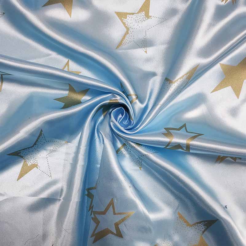 Tessuto Raso Carnevale Azzurro con Stelle Oro Image
