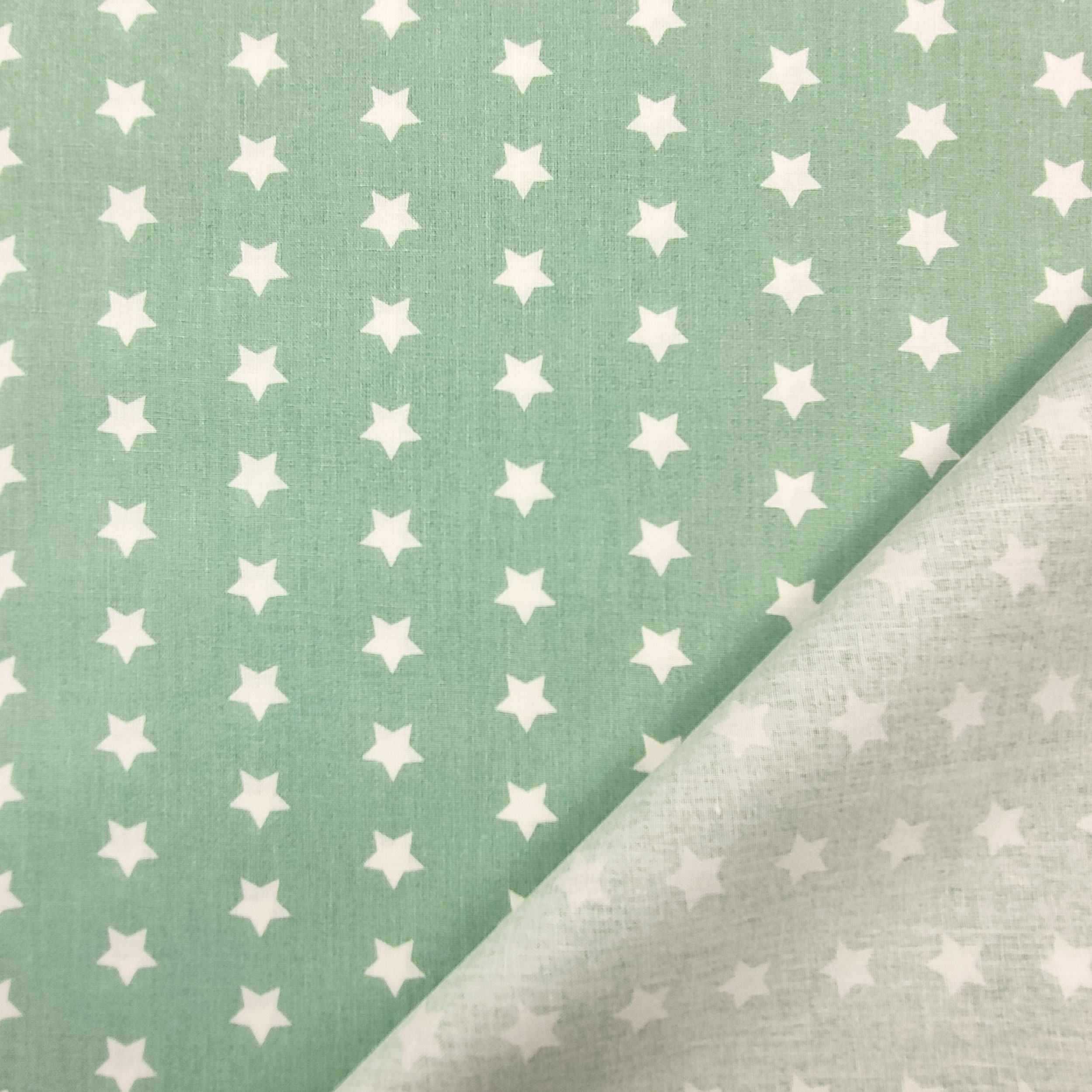 tessuto di cotone sfondo verde marino stelle bianche