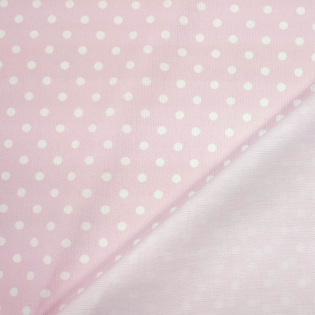 Tessuto happy piquet sfondo rosa con pois