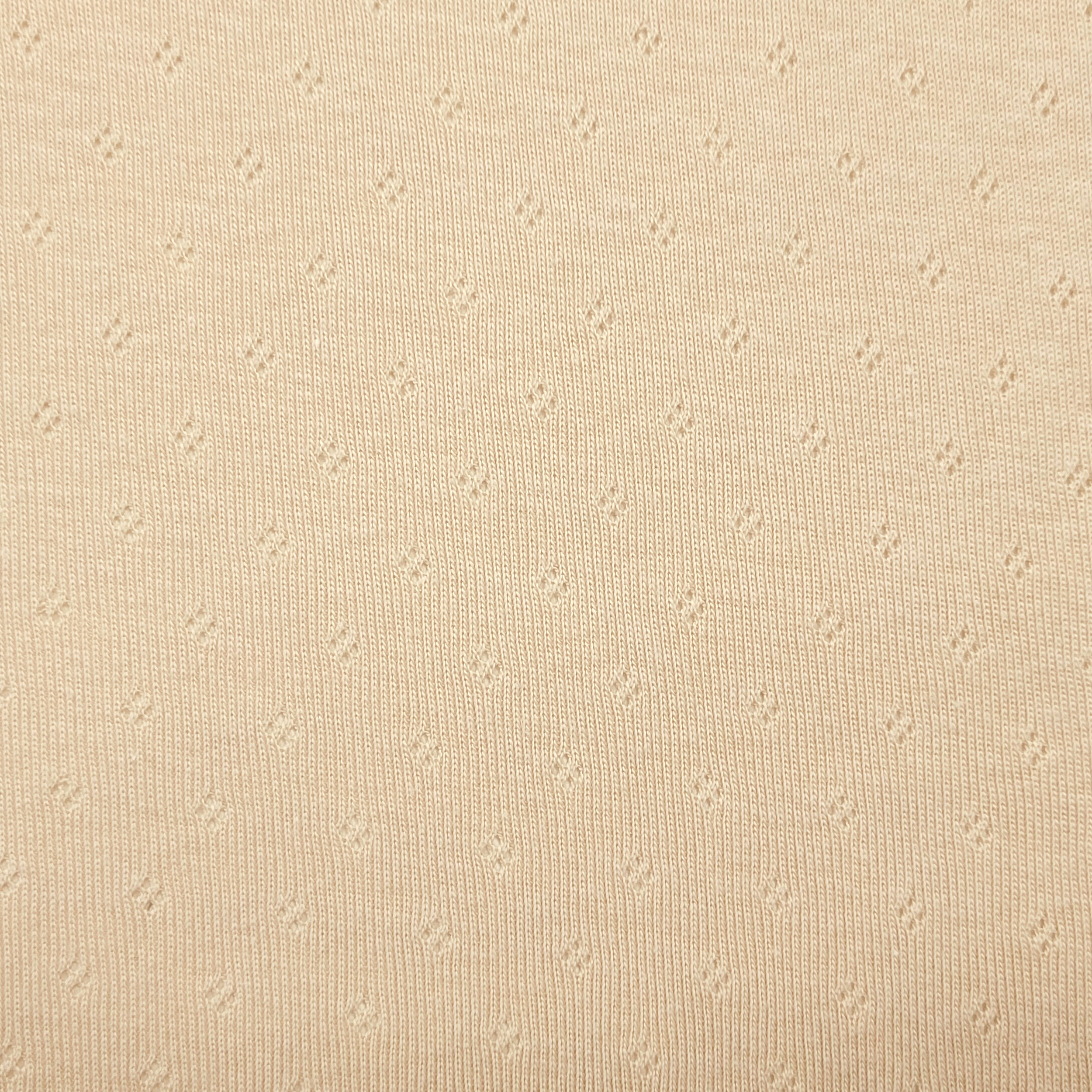 Jersey Cotone Fiori Traforati su Sfondo Beige Chiaro