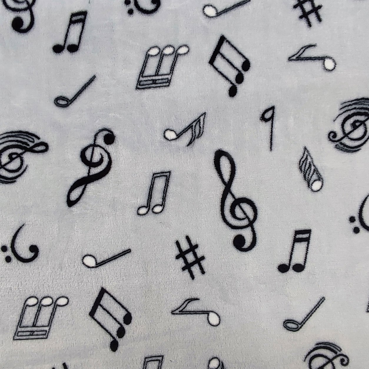 Tessuti pile note musicali grigio