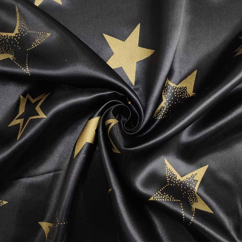 tessuto per vestiti di carnevale nero stelle oro