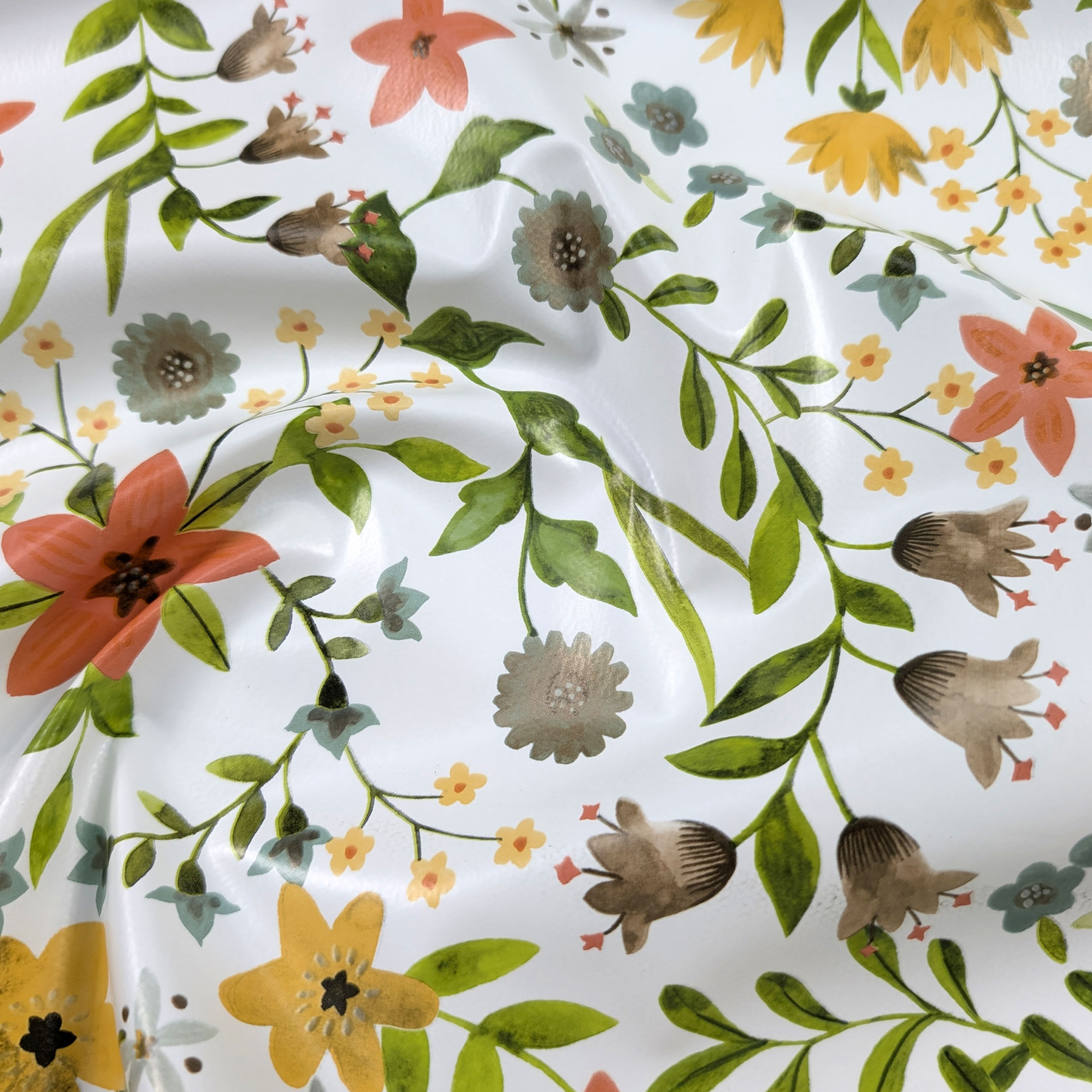 Tessuto per Tovaglia Plastificata Fiori Toni Caldi Image