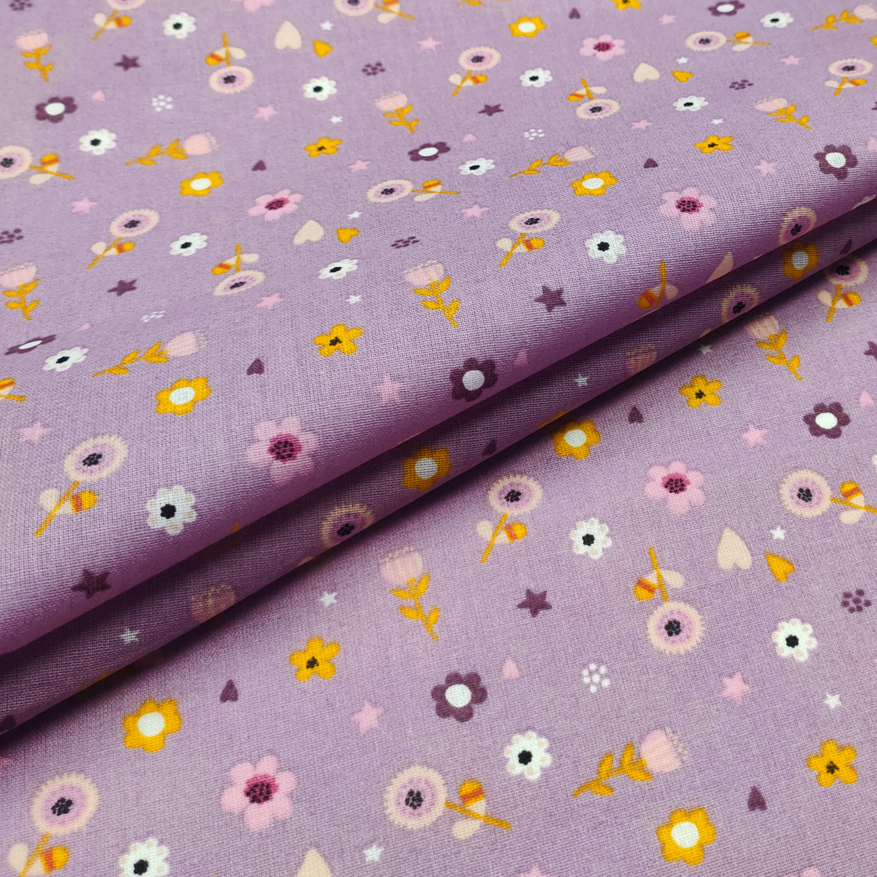 stoffa-di-cotone-con-fiorellini-sfondo-lilla