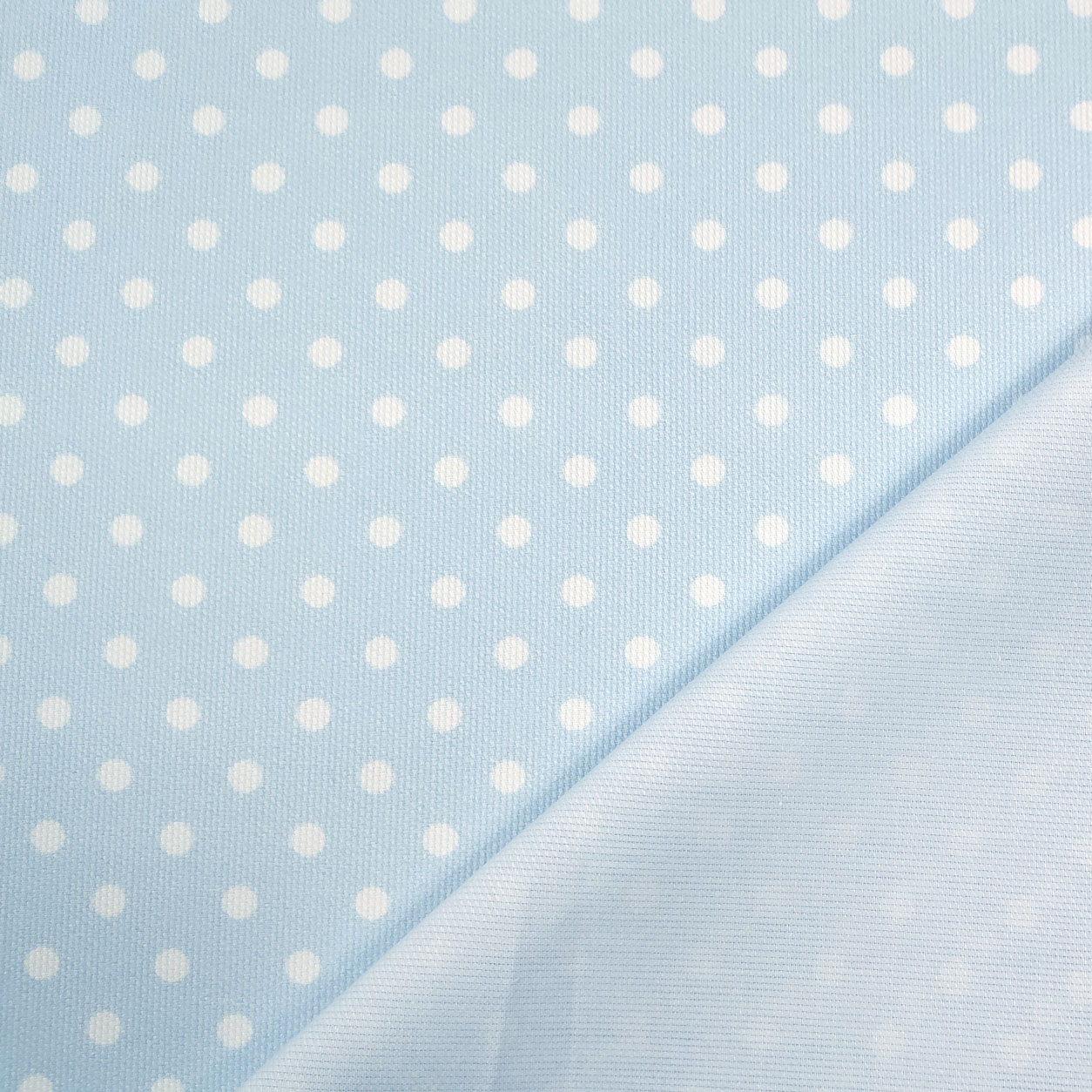 Tessuto happy piquet con pois bianchi sfondo azzurro
