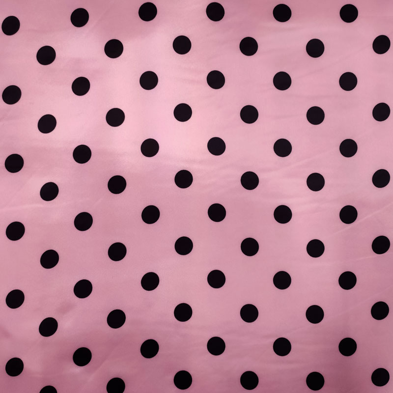 Tessuto carnevale pois neri sfondo rosa