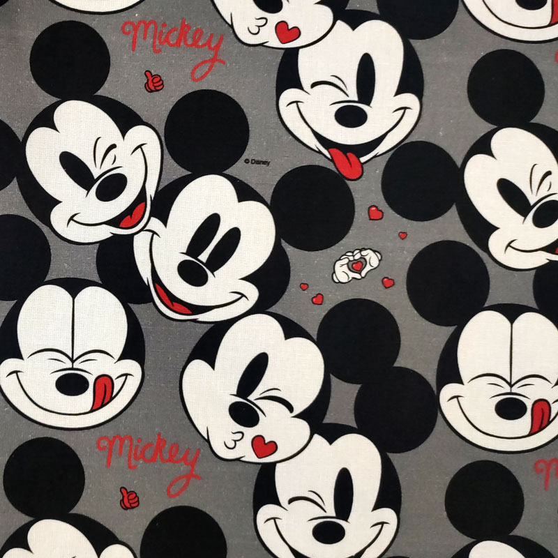 Tessuto cotone disney faccine mickey mouse grigio