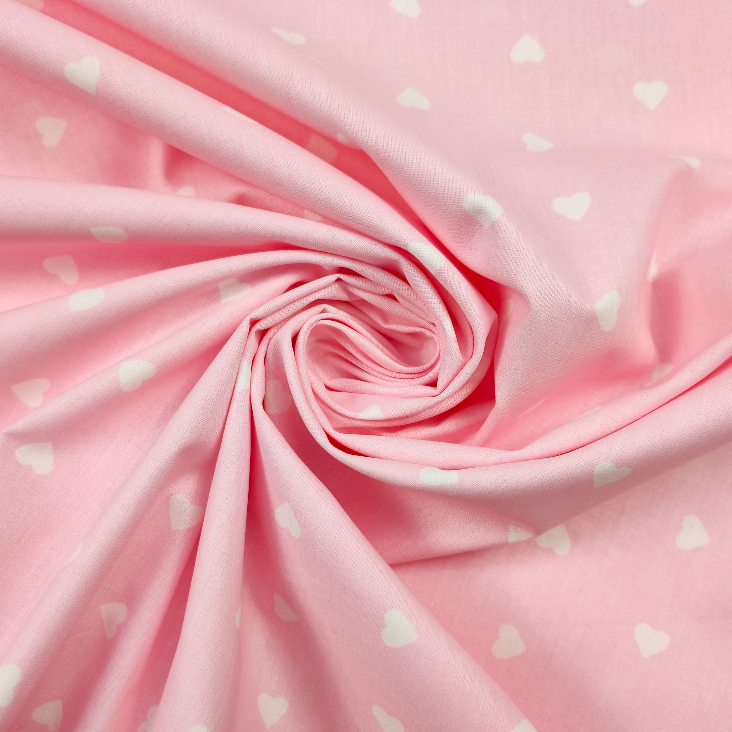 tessuto di cotone leggero cuori bianchi sfondo rosa