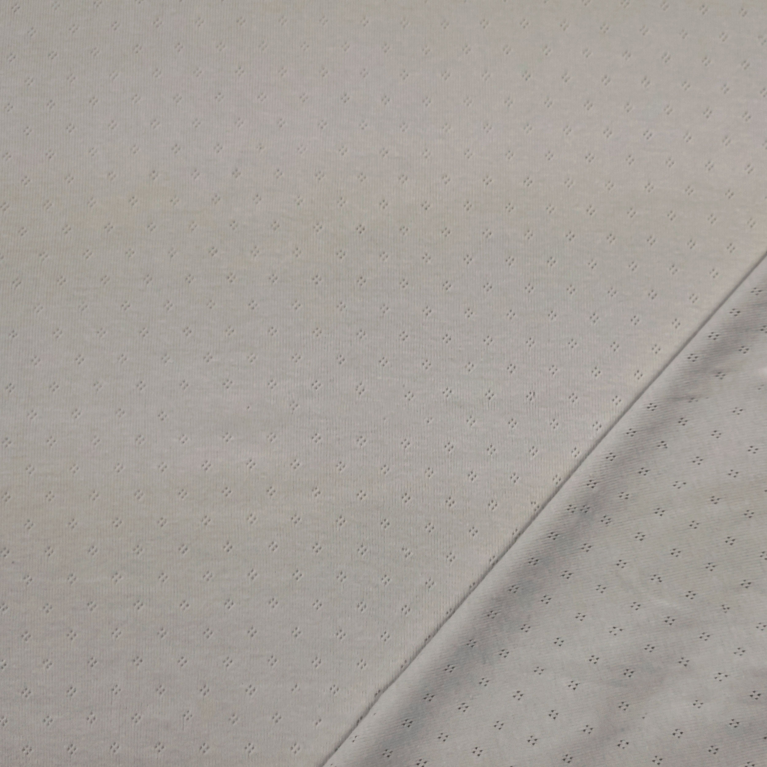Jersey Cotone Fiori Traforati su Sfondo Grigio Chiaro