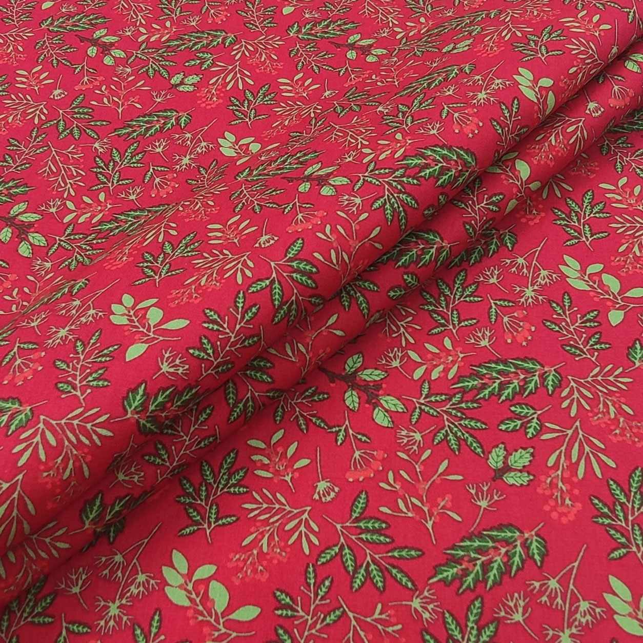 tessuti-cotone-agrifoglio-sfondo-rosso