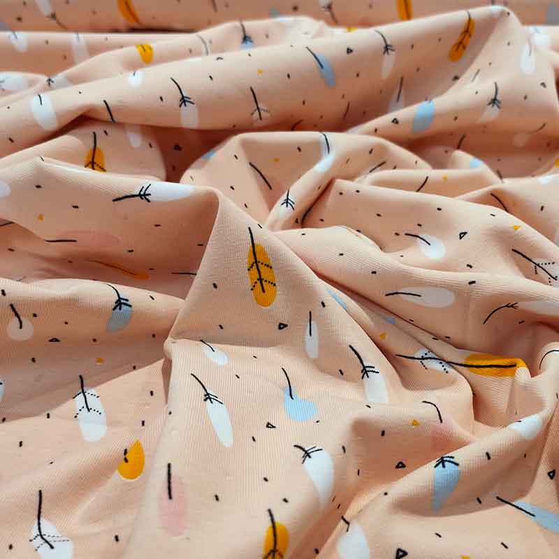 Tessuto Jersey Piume Colorate su Sfondo Salmone