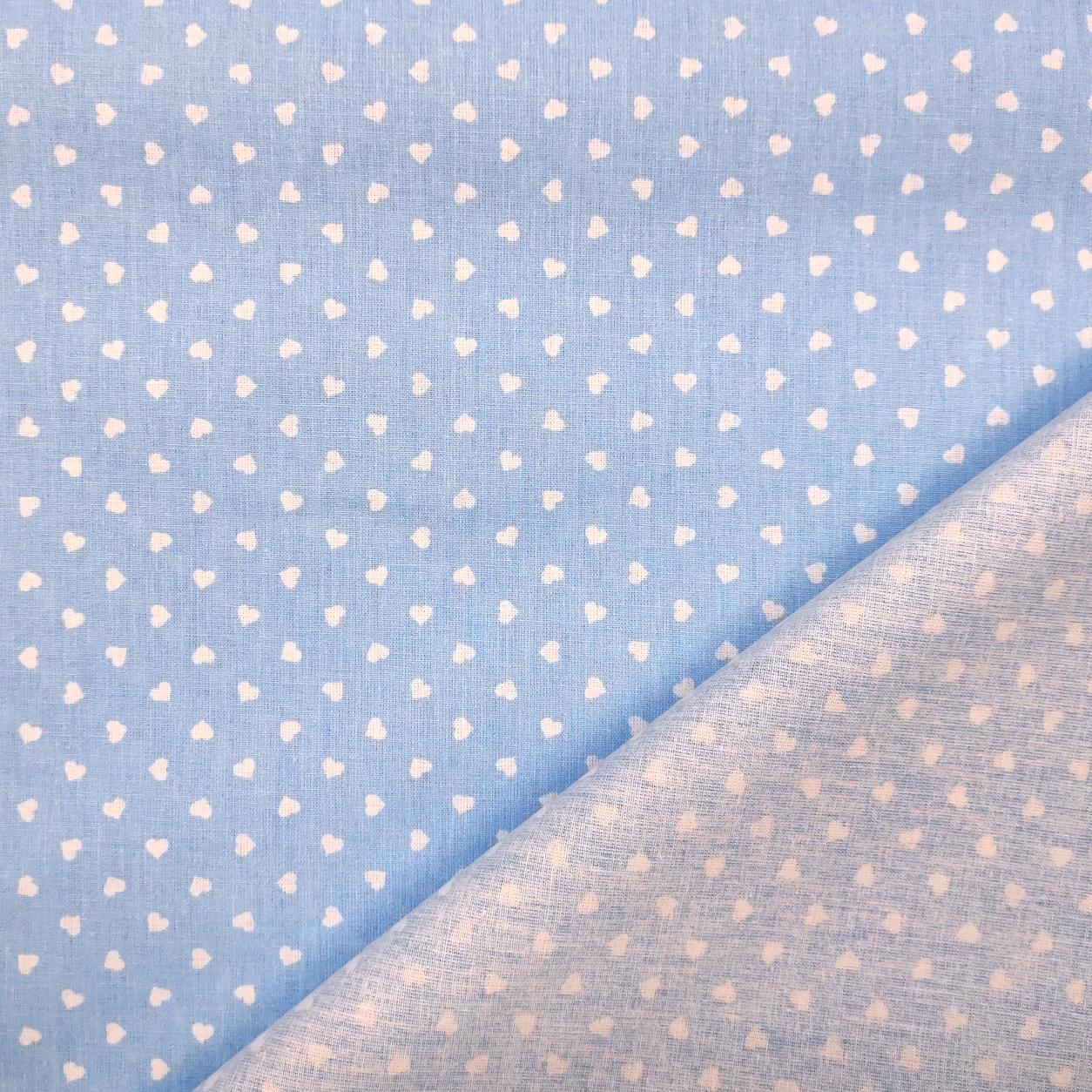 tessuto cotone leggero percallino cuori bianchi sfondo azzurro