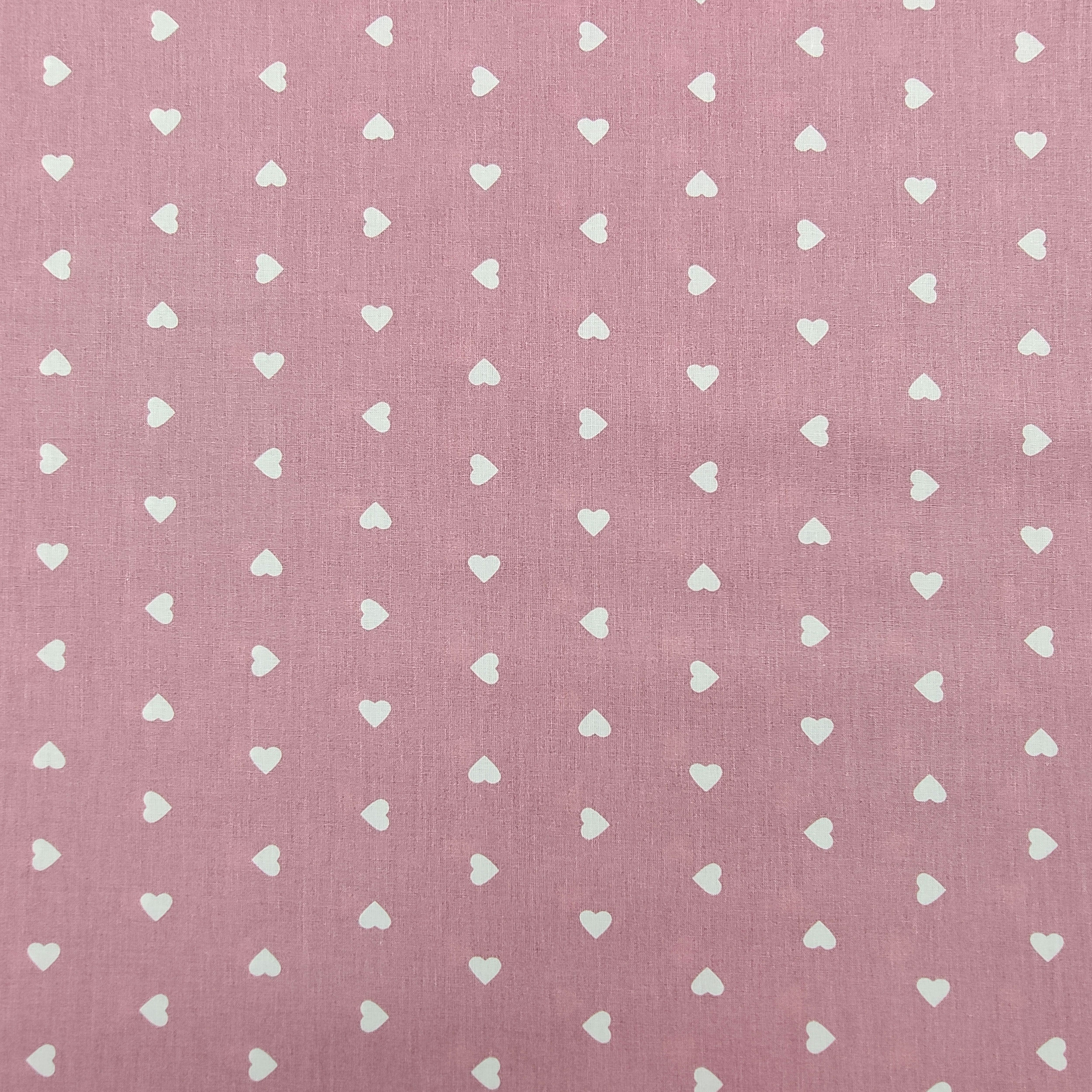 stoffa in cotone cuori bianchi sfondo rosa antico