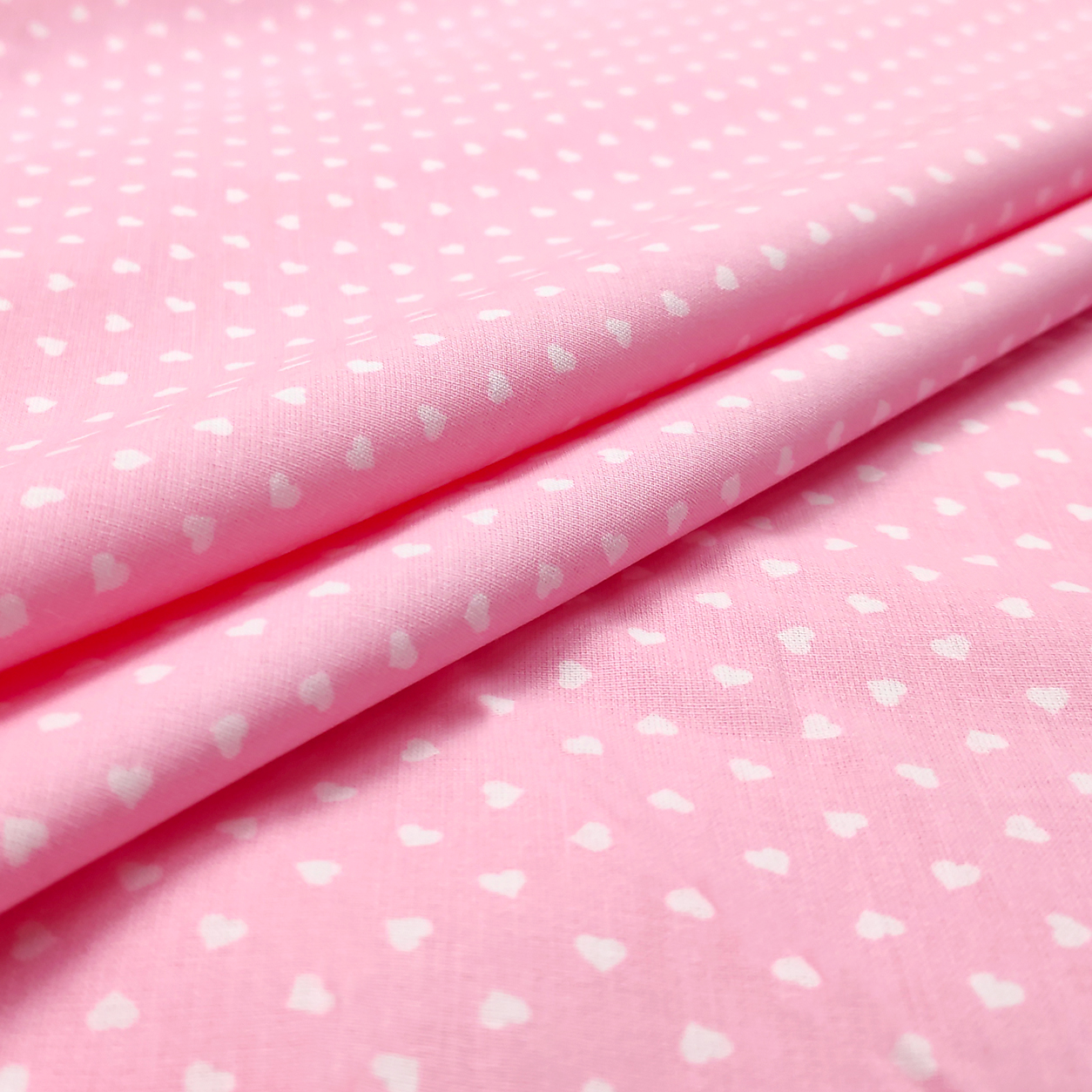 Cotone percallino cuori bianchi sfondo rosa