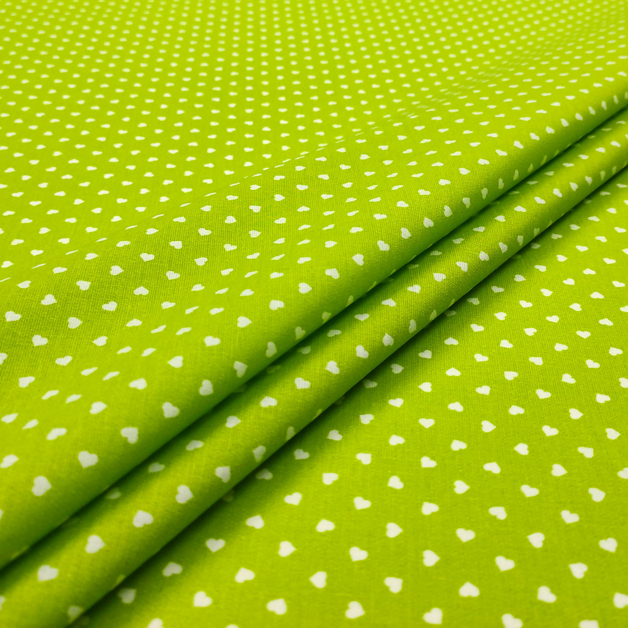 Cotone percallino cuori bianchi sfondo verde
