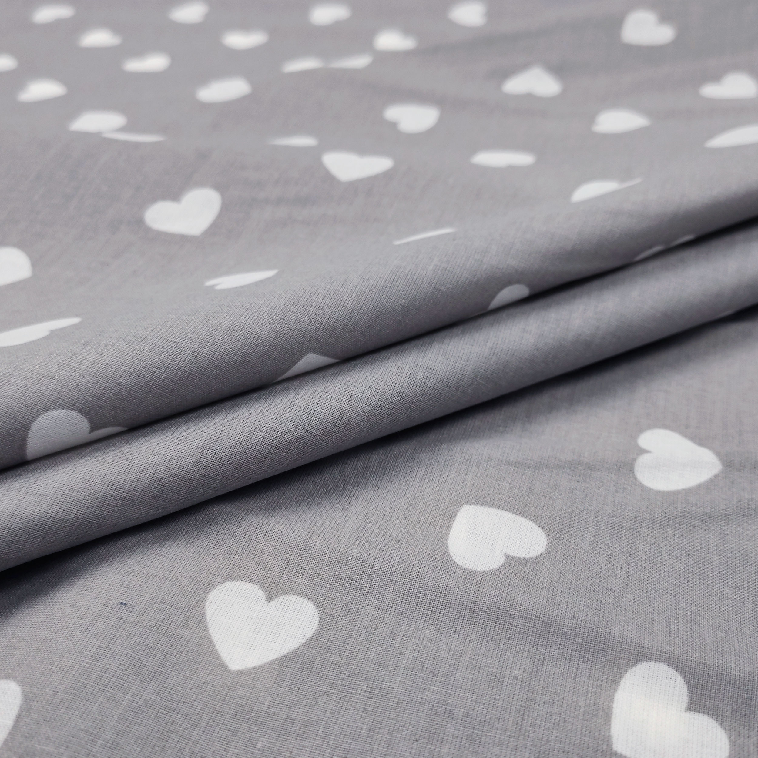 Cotone Fantasia Cuori Bianchi con Sfondo Grigio