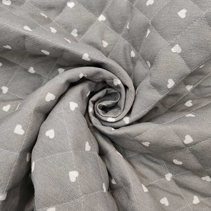 tessuto-trapuntato-online-cuori-bianchi-sfondo-grigio