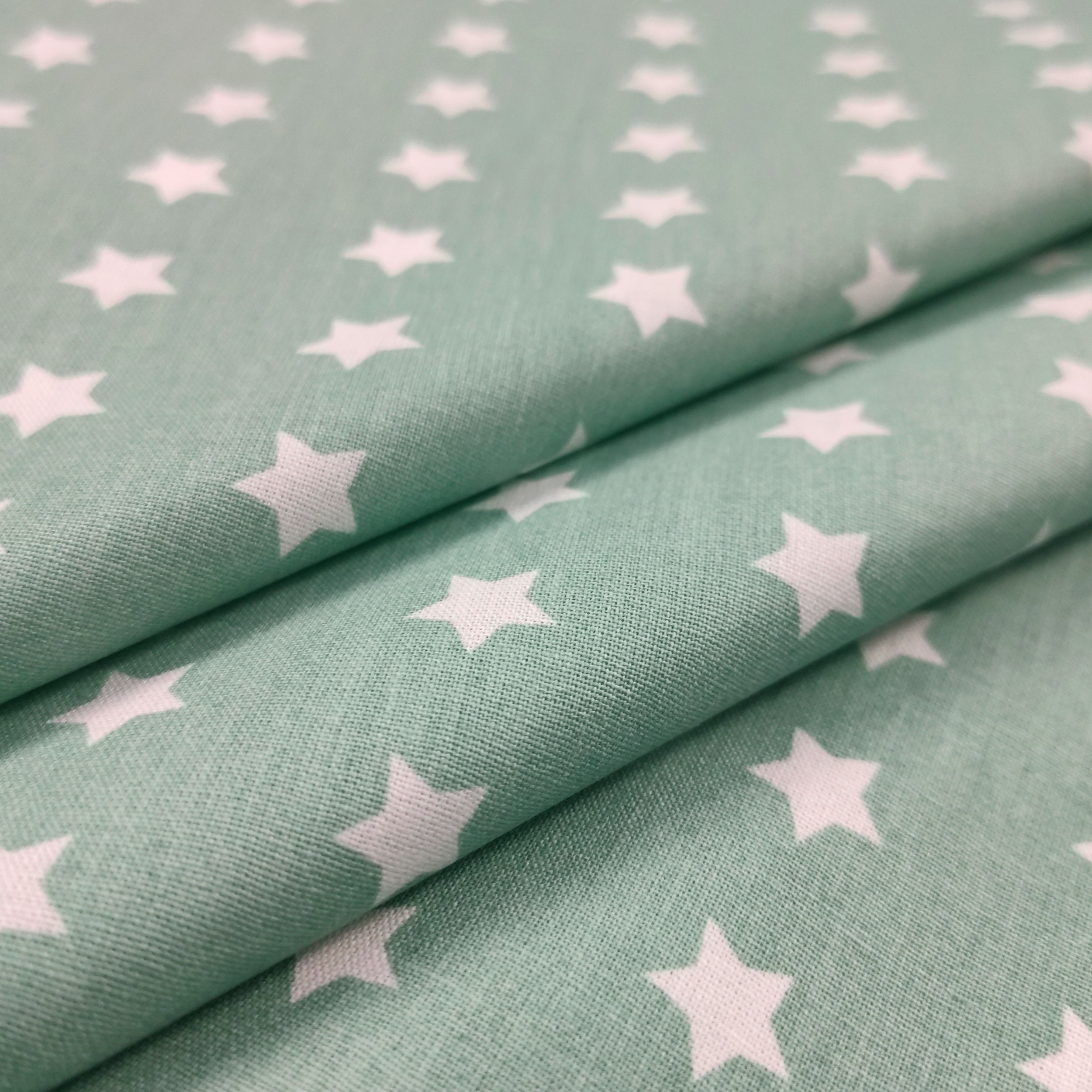 cotone per abbigliamento sfondo verde marino stelle bianche