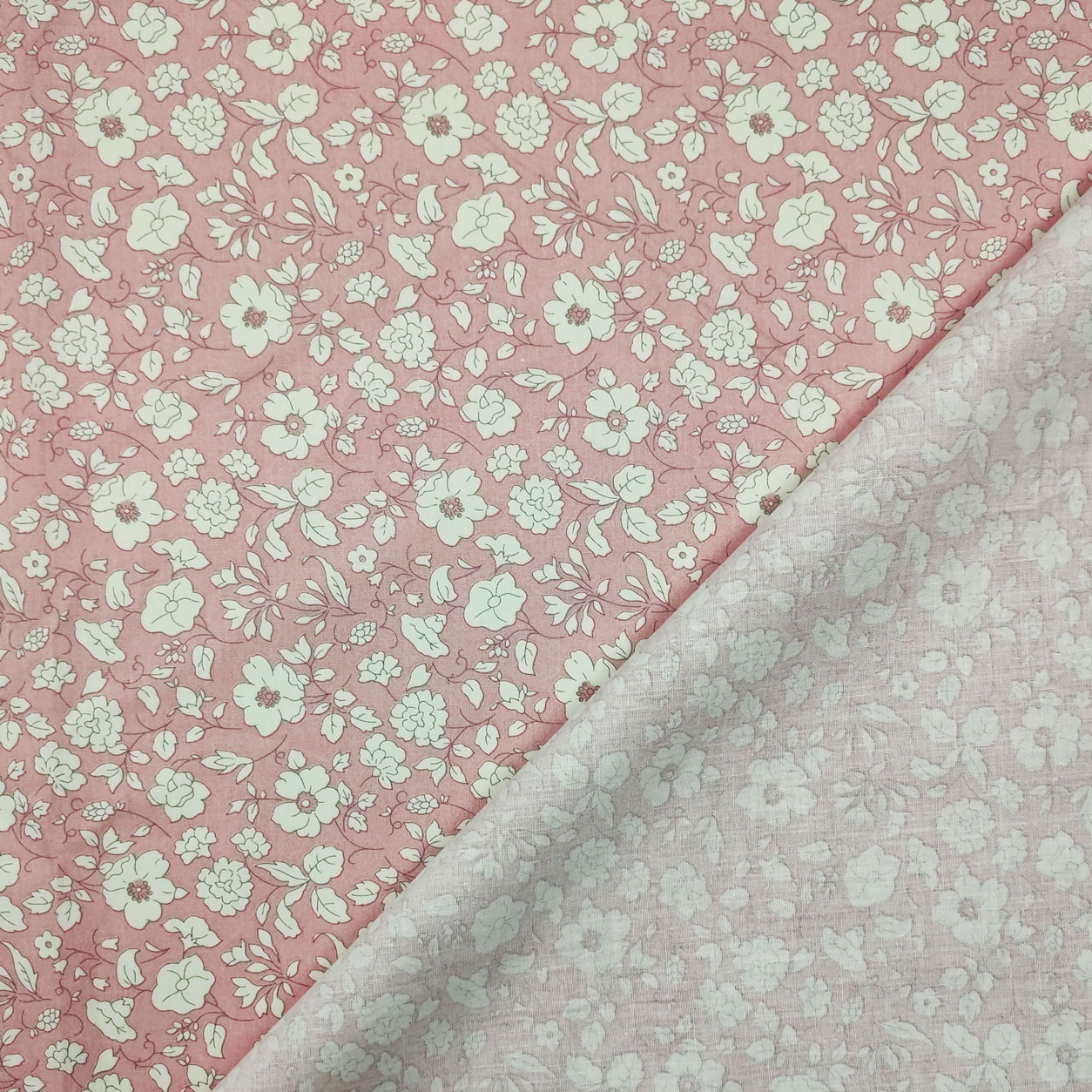 tessuto-cotone-fiorellini-bianchi-sfondo-rosa