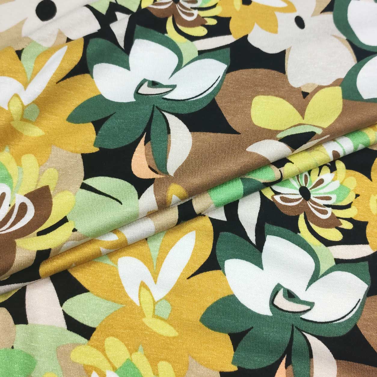Tessuto jersey elasticizzato fiori ocra e verdi