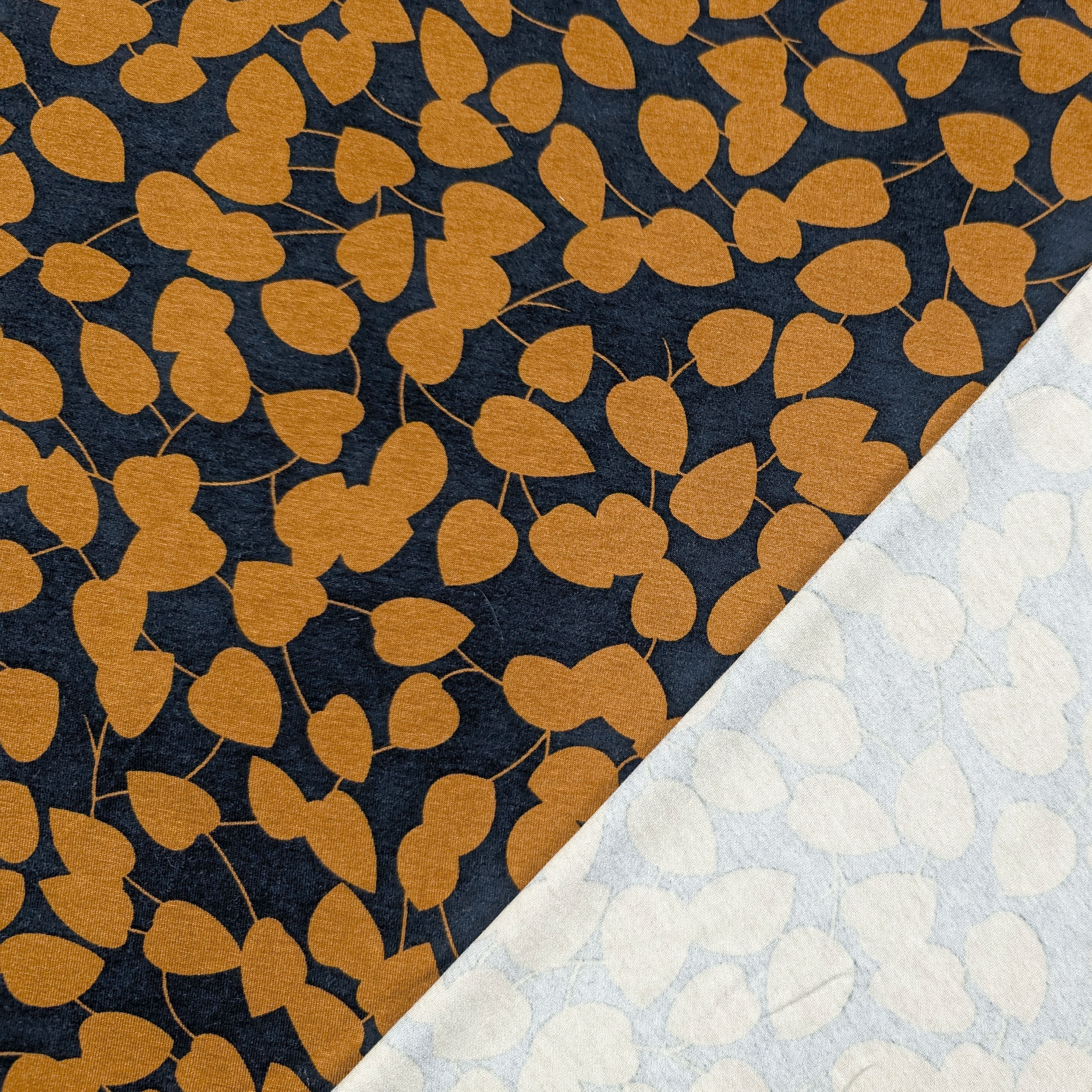 Jersey Cotone Foglie Ocra Sfondo Blu Image