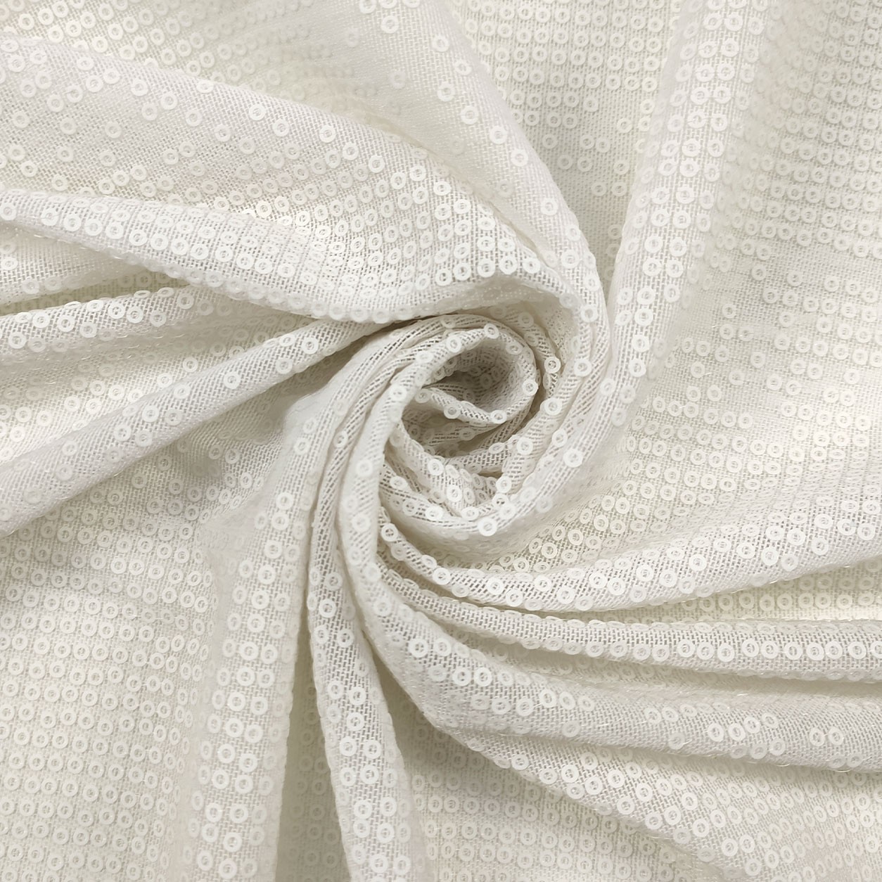 tessuto-abbigliameto-trasparente-paillettes-bianco