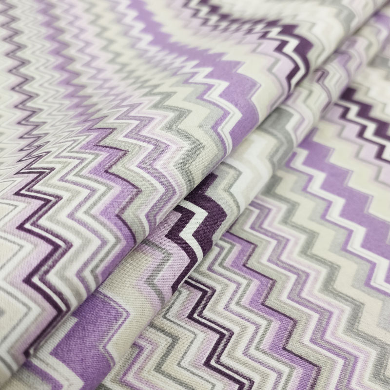 Tessuto di cotone zig zag viola