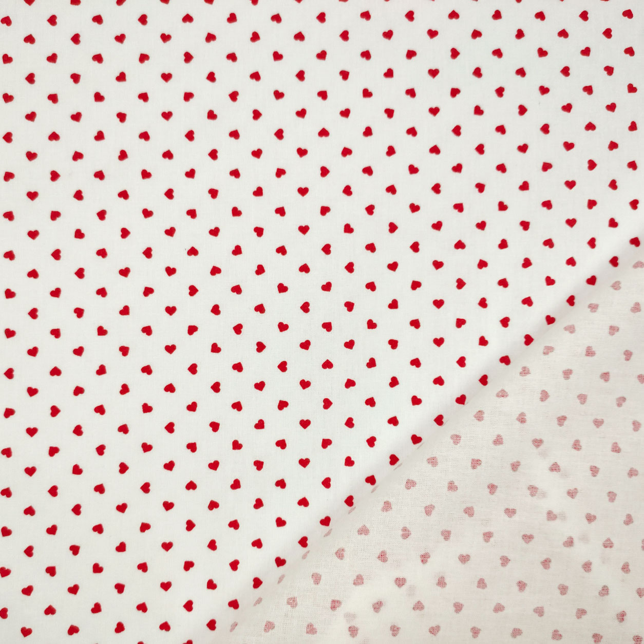 Cotone tessuto leggero percallino sfondo bianco cuori rosso