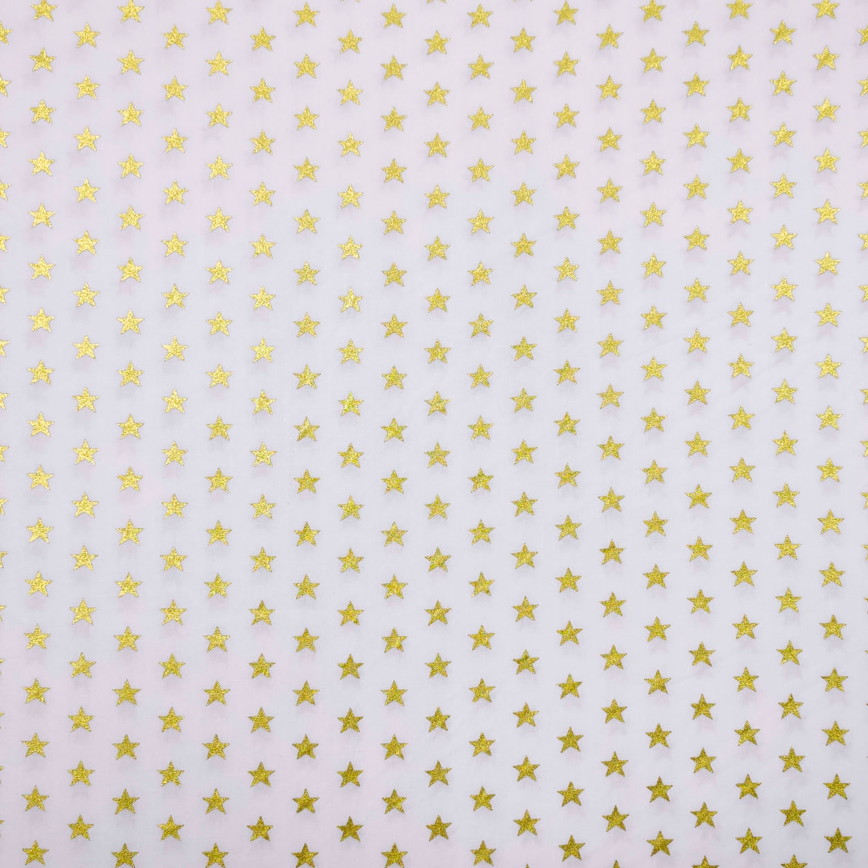 Tessuto Cotone Fantasia di Stelle Oro
