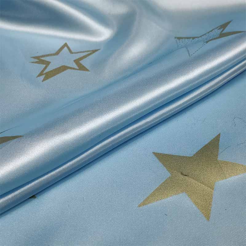 Tessuto Raso Carnevale Azzurro con Stelle Oro Image