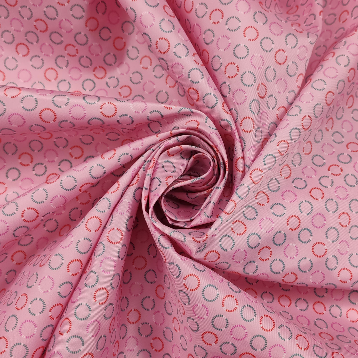 tessuto-impermeabile-con-fantasia-di-cerchi-sfondo-rosa