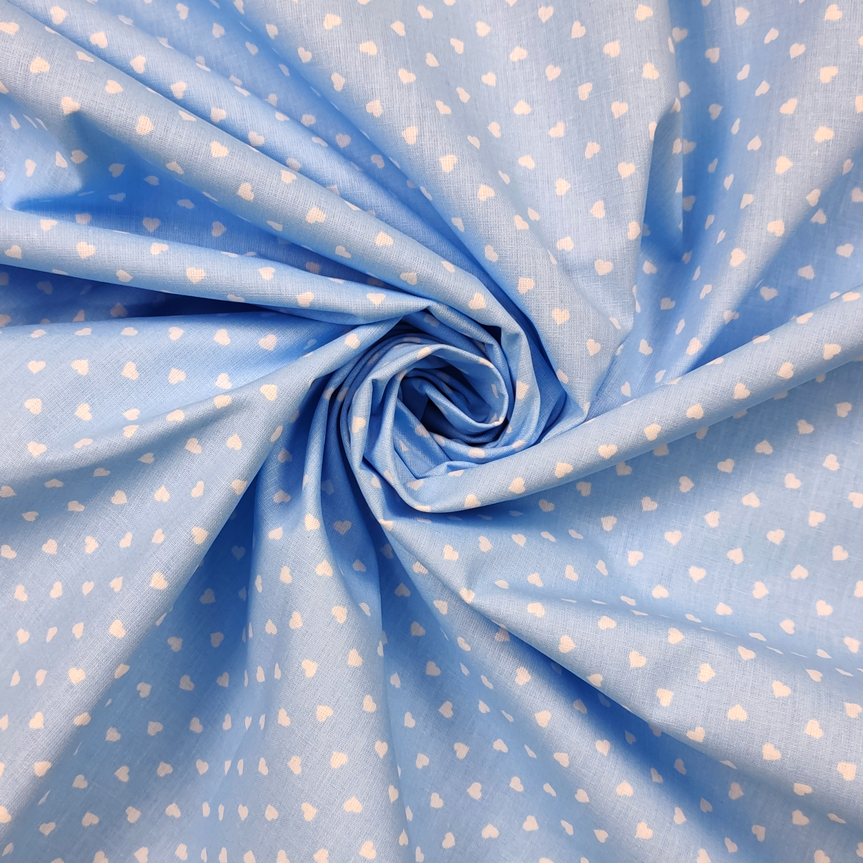 tessuti-cotone-percallino-cuori-bianchi-sfondo-azzurro