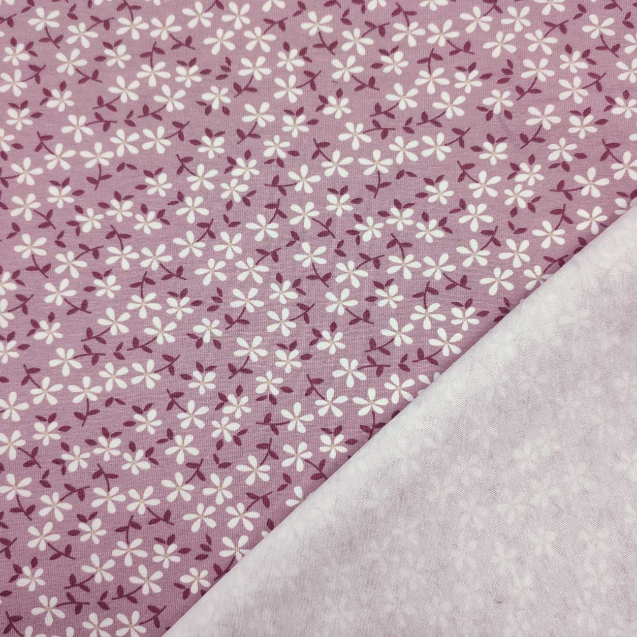 tessuto-online-jersey-con-fiorellini-bianchisfondo-rosa-antico